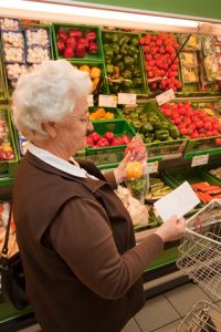 woman reading grocery list at the store