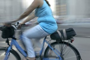 bigstock-overweight-woman-riding-bicycl-21670745
