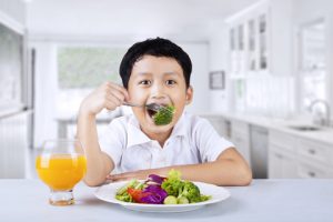 http://www.dreamstime.com/stock-photo-happy-boy-eating-salad-broccoli-inside-home-image30044420