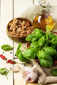 http://www.dreamstime.com/royalty-free-stock-photography-basil-nuts-olive-oil-bunch-fresh-bowl-walnuts-pepper-garlic-glass-bottle-served-white-wooden-table-see-series-image36664137