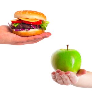 Choice between healthy apple and unhealthy hamburger
