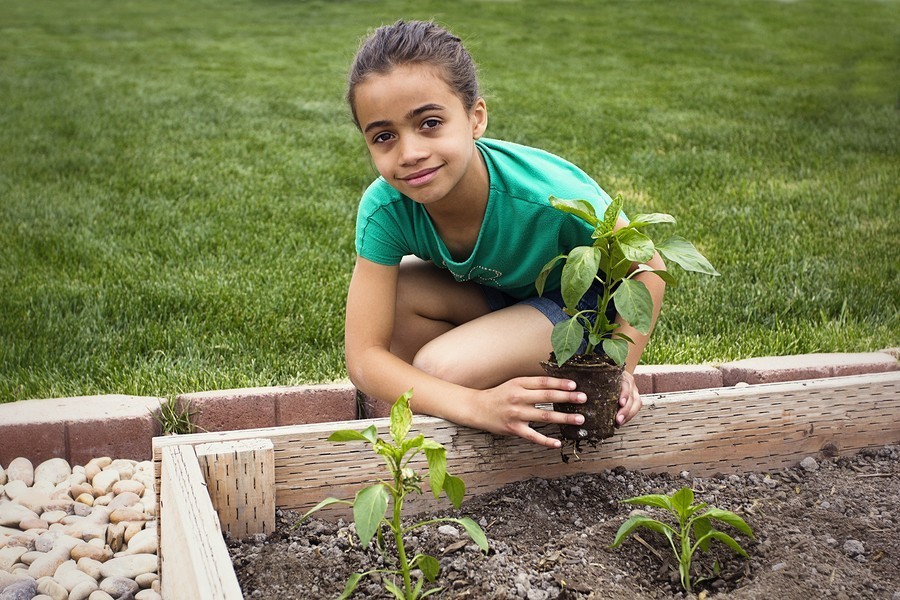 girl planting in her garden
