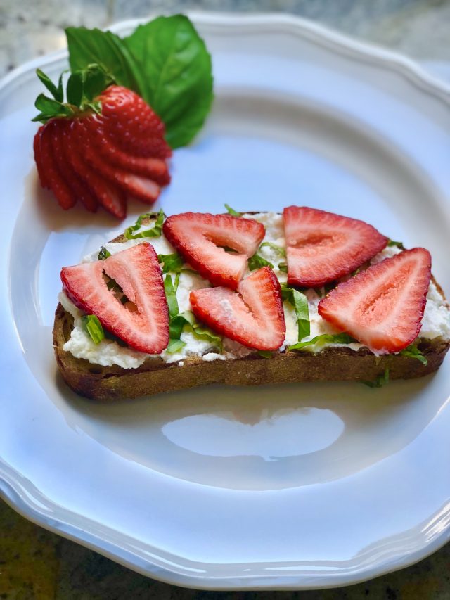 breakfast toast with ricotta, strawberries, and basil