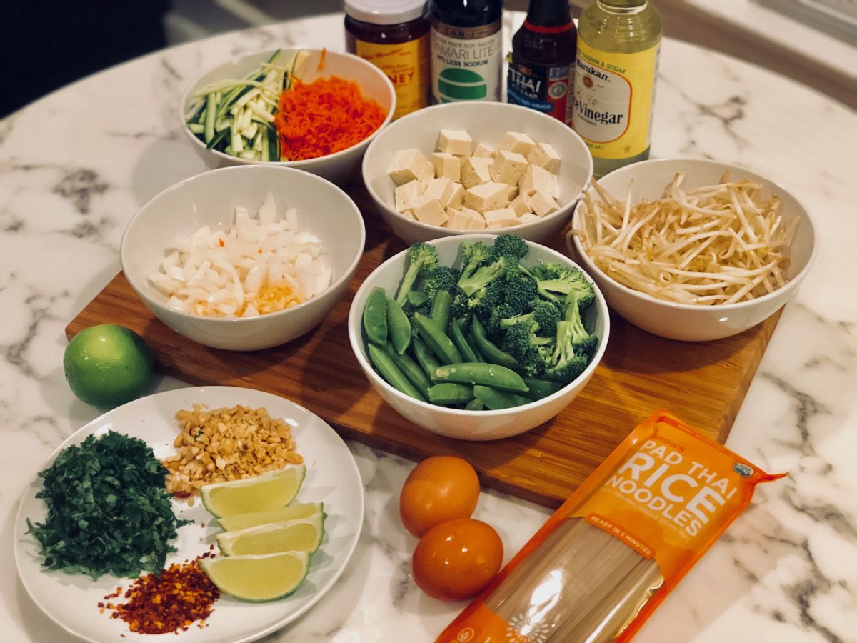 ingredients for fresh and light veggie pad thai spread out on a table