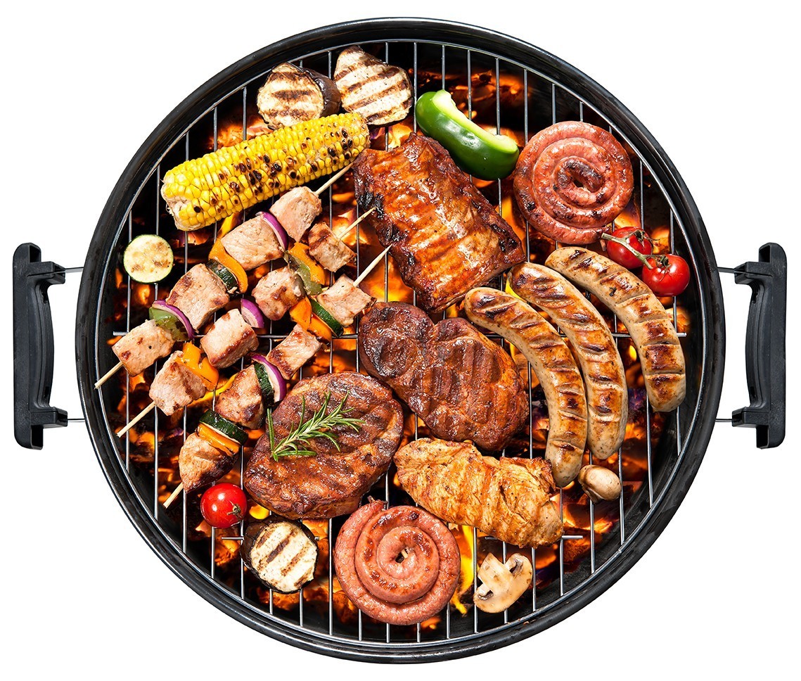 a BBQ covered in grilled meats and vegetables