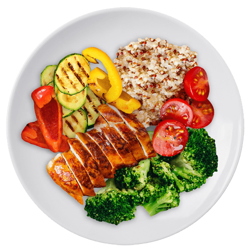 a dinner plate containing a 3 ounce serving of chicken, with assorted vegetables and the wholegrain quinoa.